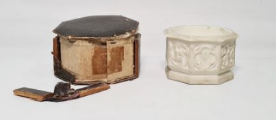 A mid 19th century, Victorian, parian travelling font, with its original leather and velvet