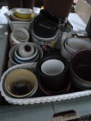 Large quantity of ceramic plant holders, a quantity of glass including Art Deco pink candlesticks,