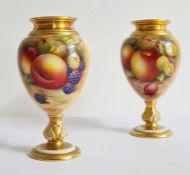 A matched pair of two Royal Worcester fruit painted oviform vases, the first with printed  purple