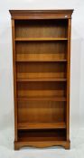 20th century yew open bookcase raised on bracket feet, 78cm x 181.5cm
