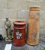 A painted chimney pot, another chimney pot and a garden figure of a monk with deer