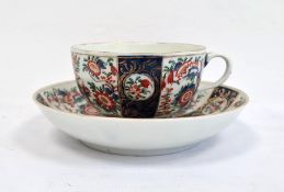 Worcester teacup and saucer, 1760-1770, blue fret marks and iron-red chinoiserie-style monogram,