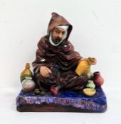 Royal Doulton pottery seated figure 'The Potter' HN1493, 17cm wide