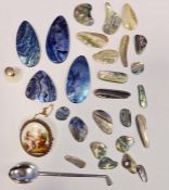 White metal spoon in the form of a golf club and a collection of iridescent mother-of-pearl pendants