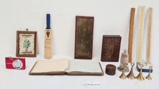 19th century brass cribbage board, an autograph book, a miniature cricket bat, various rulers, a
