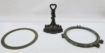 A bronze porthole and a 19th century Coalbrookdale style doorstop