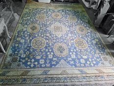 Large Chinese blue ground rug, the central medallion surrounded by further medallions, the sky