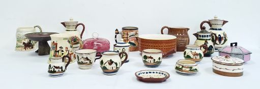 Collection of Torquay pottery ware to include hot water jugs, milk jug, cups, etc, a 20th century