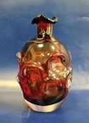 Ruby red Art glass of Whitefriars 'Knobbly' type, of bottle-shaped form with petal-shaped everted