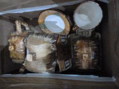 Various items of cottageware to include teapot, butter dish, cream jug, lidded pot, teacup and