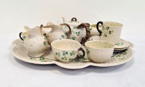 Belleek porcelain cabinet set comprising lobed oval tray, teapot with branch-pattern bifocated