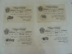 Four Bank of England notes viz:- KO Peppiatt white £5 note April 25th 1935, BG Catterns white £10