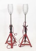 Pair of floor uplighters, the bases as axle stands (2)