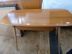 Ercol elm serving table, rounded rectangular with under sliding drawer, on square section
