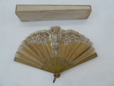 An early 20th century wooden and painted gauze fan, gold decoration depicting an owl painted in