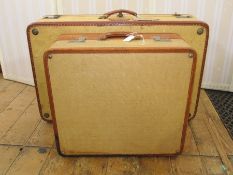 Leather canvas and leather suitcase with a smaller matching made by Victor Luggage, the smaller case
