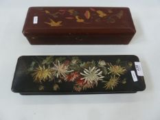Two Oriental lacquered glove boxes, one red lacquer with hinge lid and one black lacquer with red