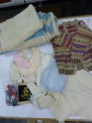 Cream embroidered baby/christening shawl, another shawl, a knitted blue blanket, matinee jackets,