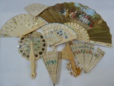 Two pierced bone and painted fans, a miniature pierced bone fan and various ivory type fans, some