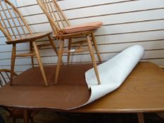 Ercol blonde elm dining table, rounded rectangular and four Ercol light elm Quaker dining chairs