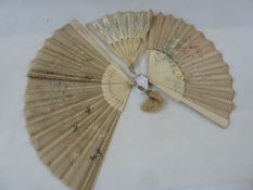 A late 19th century bone and painted gauze panel fan, floral and bird decorated with lace detail,
