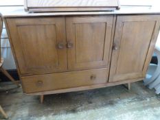 Ercol blonde elm sideboard having double doored cupboard with single drawer below and further single