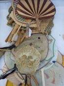 A quantity of Oriental circular fan/ hand screens, some gauze and hand painted, a horn hand