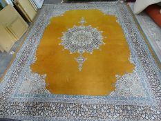 Eastern mustard ground rug with central medallion, stepped border, 374cm x 278cm