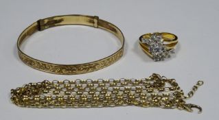 Gold coloured and white stone cluster ring marked 14k, a 9ct rolled gold bangle and a gold