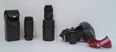 Canon A-1 camera, a Sigma Jessop 52mm 1A lens in case and a Sigma 55MM Skylight (1B) zoom lens in