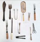 Two silver sugar nips, a silver plated ladle, silver fish servers and other plated wares