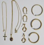 9ct gold crucifix on 9ct gold chain, a pair of 9ct gold hoop earrings, another gold hoop earring and