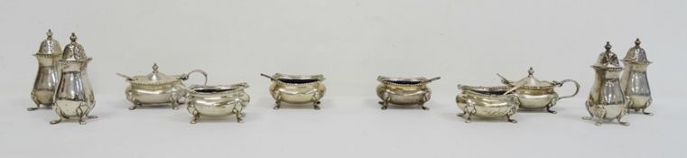 1920's ten piece silver cruet set with blue glass liners, gadrooned border, Birmingham 1928,