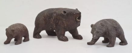 Carved Black Forest bear with glass eyes and white teeth (one eye missing and some teeth missing),