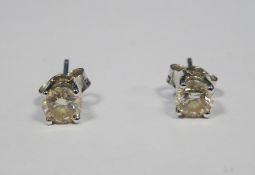 Pair of 18ct white gold and diamond earrings each brilliant cut claw set, approx. 0.4ct each