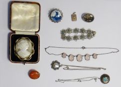 Cameo brooch set in gold-coloured mount, a silver-coloured pendant with turquoise and shell inlay, a