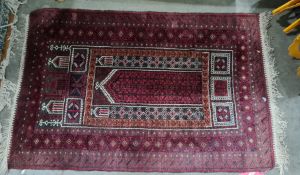 Eastern rug, red ground, stepped border, red plaques and white, 132cm x 90cm