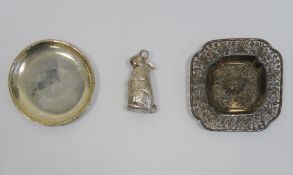 White metal and foreign silver wares to include pin dish, embossed and pierced tray and rattle in