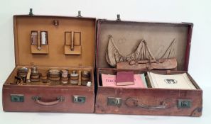 Leather suitcase with various music sheets and a leather suitcase with dressing travelling set to
