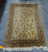 Modern cream ground rug with allover foliate decoration, 197cm x 141cm and another similar,
