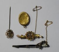 Victorian gold brooch decorated with harp and clovers (marks worn), a gold-coloured locket, a gold