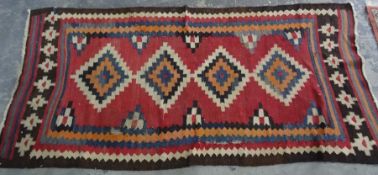 Modern rug, red ground with stepped diamond-shaped medallions, stepped border, 242cm x 114cm