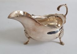 Early 20th century silver cream jug, of plain form with three splayed feet, Birmingham, makers