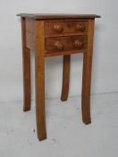 Oak two drawer side table, on swept square section supports, 48 x 82cm