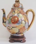 Early 20th century Japanese porcelain oviform teapot, cover and hardwood stand, gilt character