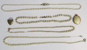 Gold coloured oval locket, Victorian heart-shaped locket and 4 simulated pearl necklaces (6)