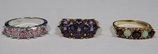 9ct gold, amethyst-coloured stone and diamond dress ring set three small diamonds surrounded by