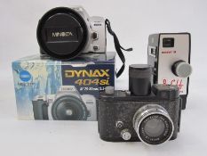 A quantity of cameras and accessories to include a Minolta 404si camera and lens, a Carl Zeiss