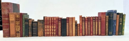 Various volumes to include Walter Scott, George Elliot, Goethe, a New Testament with carved olive