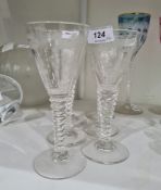 Six modern etched and cut wines each with tapering bowl etched with trees, upon faceted stem
